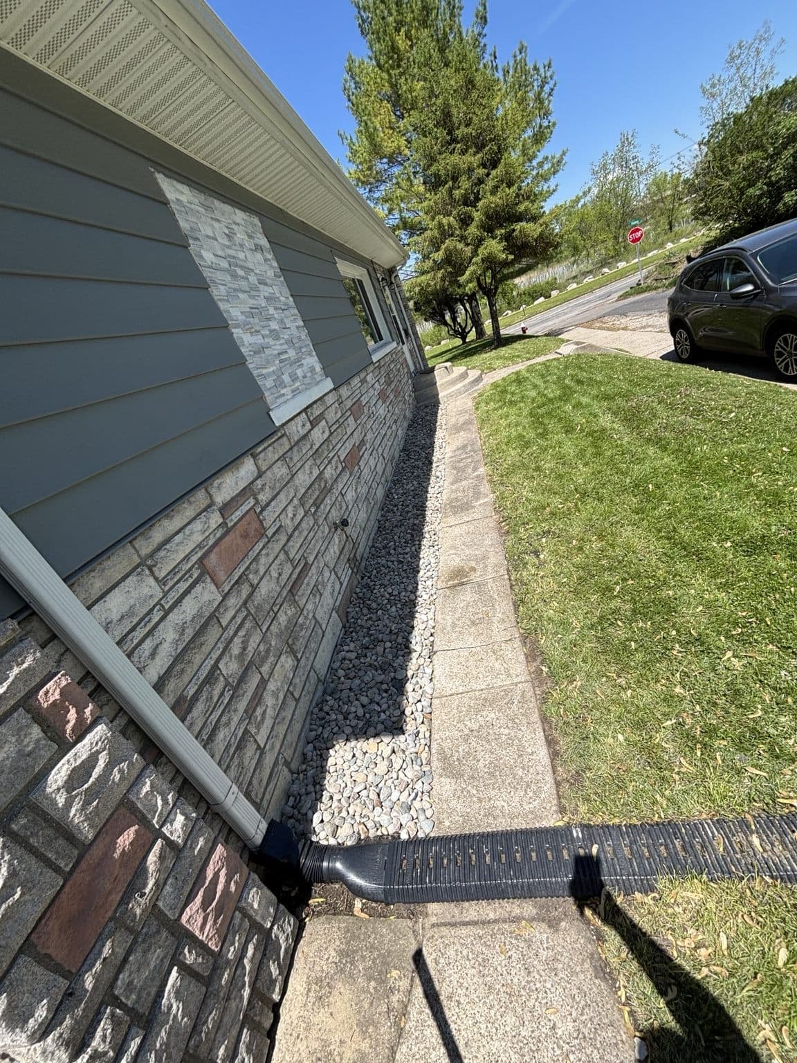 Decorative rock installed along a residential side yard